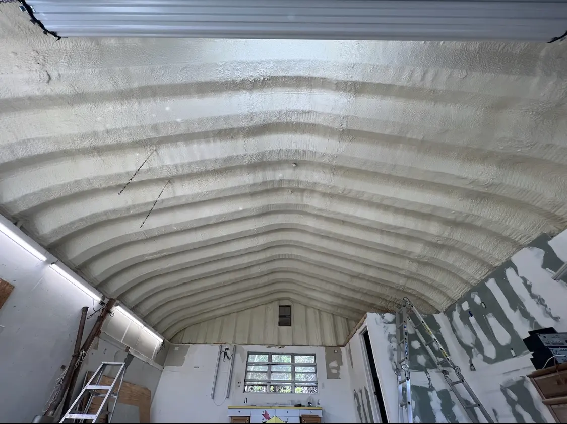 Spray polyurethane foam applied to the underside of a metal roof deck in Ludington